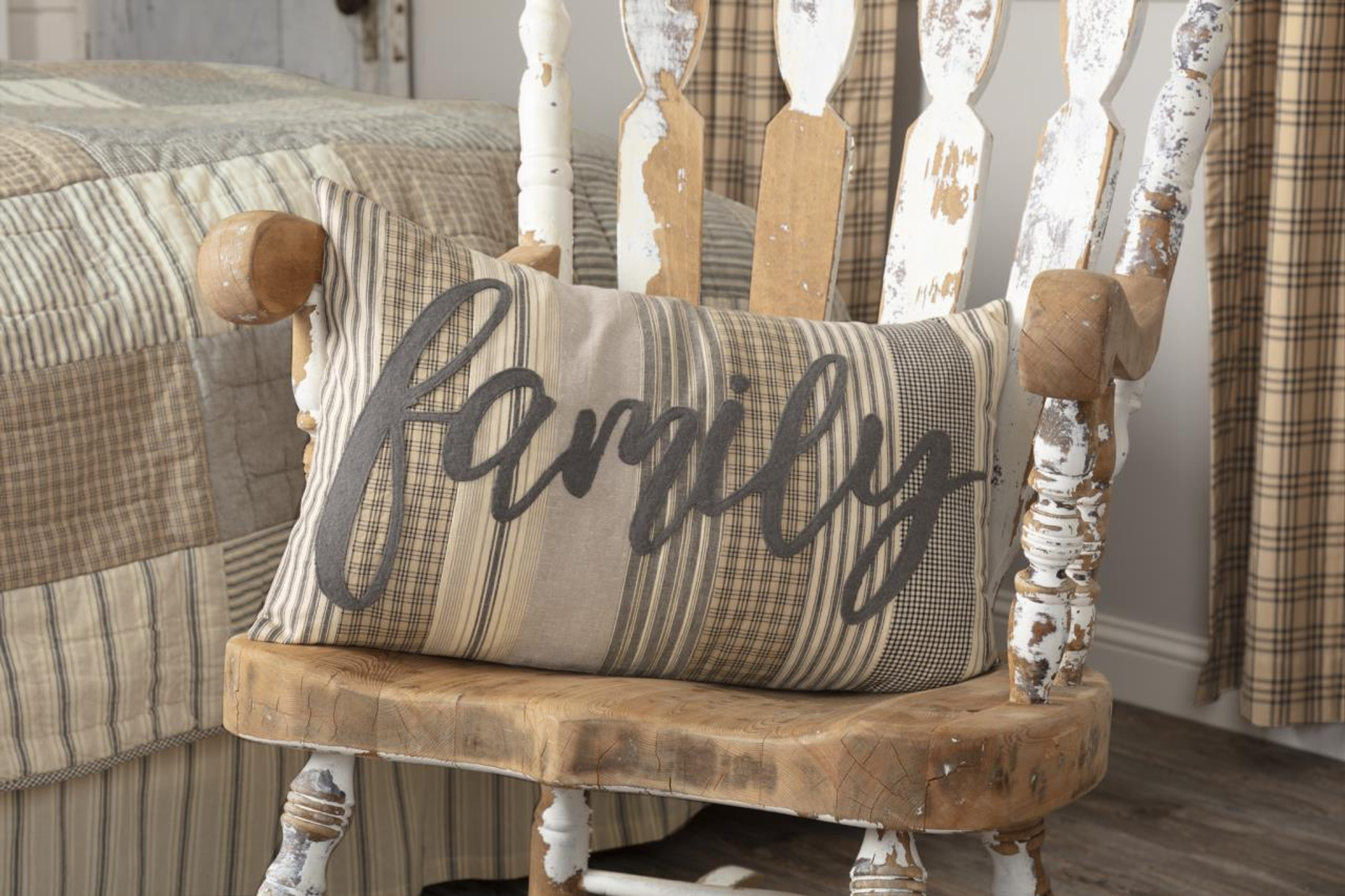 Throw pillow with the word family on a rocking chair