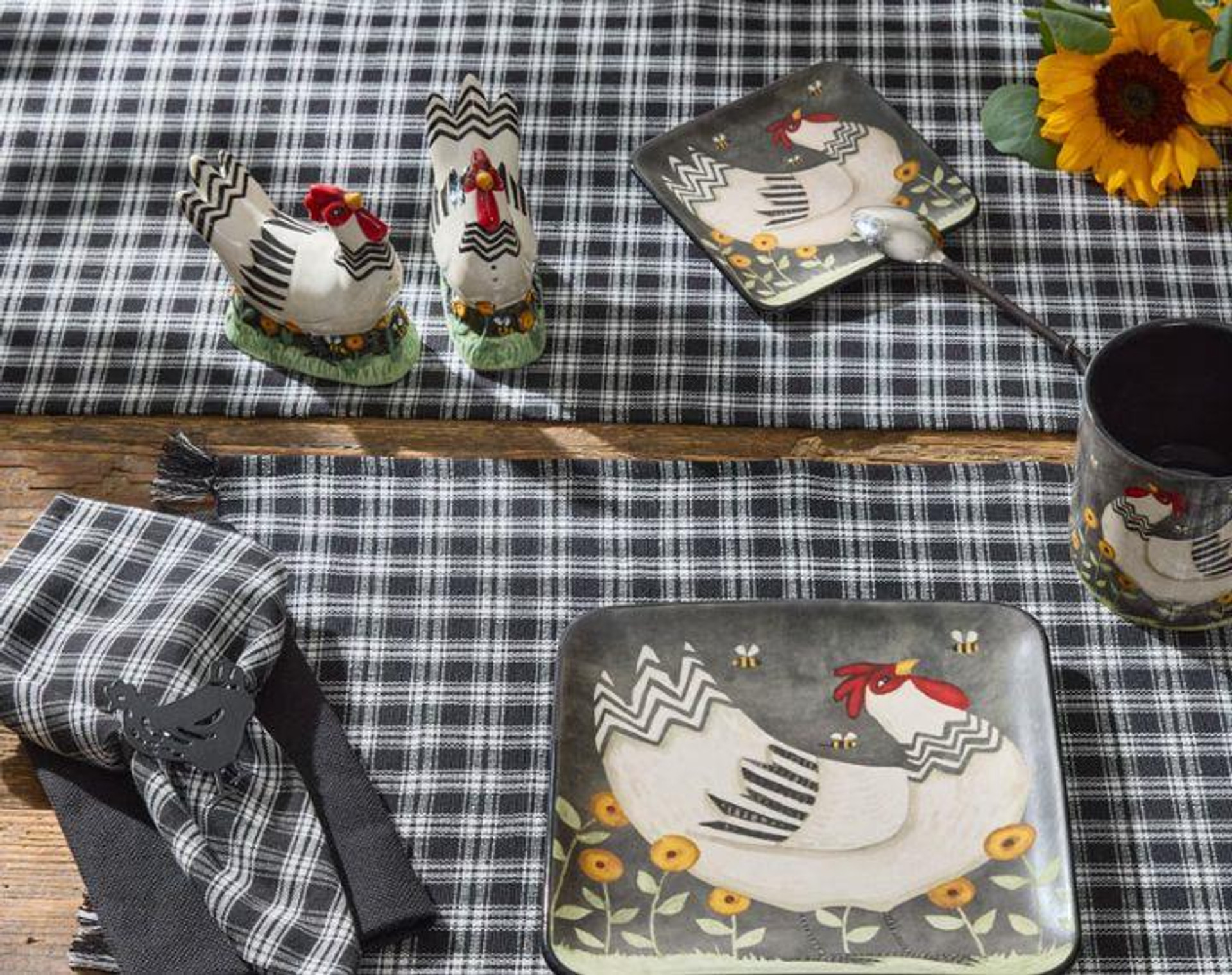 Black and cream plaid table setting with chicken accents